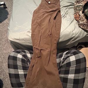 Dark brown baggy jeans.